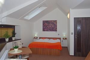 Postel nebo postele na pokoji v ubytování Hotel Pod Radnicí