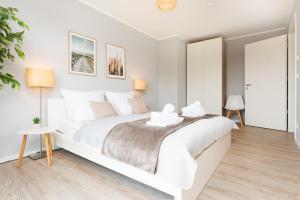 Postel nebo postele na pokoji v ubytování Idyllische Ferienwohnung am Schaalsee - Natur und Erholung pur
