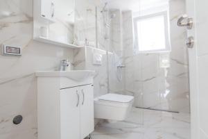 Koupelna v ubytování Villa Hanna Apartments + 19 fotografií