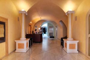 a hallway with two columns in a building at SKARITZ Hotel & Residence in Bratislava