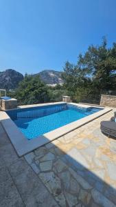 Bazén v ubytování Villa Hanna Apartments nebo v jeho okolí