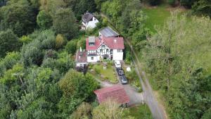 an aerial view of a house on a hill at Ferienwohnung Schäfer in Waldbreitbach +17 photos