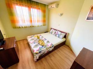 a small bed in a small room with a window at Kastela Guest House in Chernomorets +62 photos