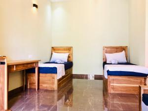 Postel nebo postele na pokoji v ubytování Sound Sleep Resort