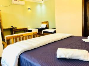 Postel nebo postele na pokoji v ubytování Sound Sleep Resort