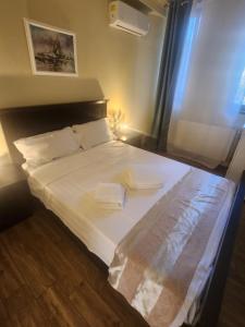 Postel nebo postele na pokoji v ubytování Adrys Boutique Villa