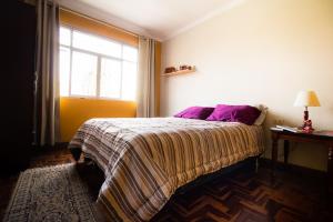 Postel nebo postele na pokoji v ubytování Casa de Viajeros