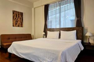 Postel nebo postele na pokoji v ubytování Baan Glang Soi Restaurant & Guesthouse