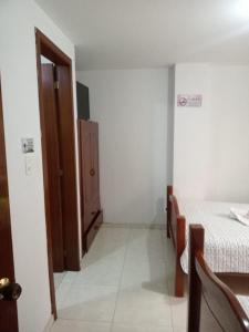 Postel nebo postele na pokoji v ubytování Hotel Manhattan City