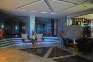 a lobby with chairs and a table in a building at Delmar Hotel Matrouh in Marsa Matruh