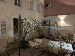 a room with tables and chairs and a building at Graça - Apartamento in Lisbon
