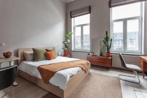 Postel nebo postele na pokoji v ubytování CNS Brussels