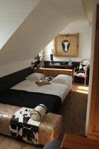 Letto o letti in una camera di Hostellerie de Genève