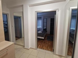 Postel nebo postele na pokoji v ubytování Apartman Tri S + 4 fotografie