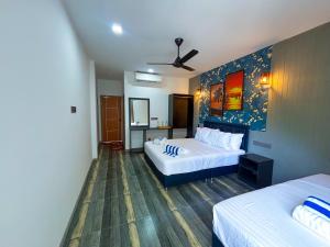 Letto o letti in una camera di Kuda Vilu, Mathiveri, Maldives