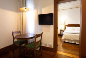 Cama ou camas em um quarto em Hotel Solar do Rosário