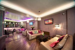 a large living room with couches and a bar at Vozdvizhenskoe Park Hotel in Serpukhov