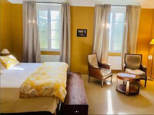 Postel nebo postele na pokoji v ubytování Hôtel de Mirmande