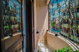 a building with stained glass windows and a staircase at Zuri homes in Mombasa