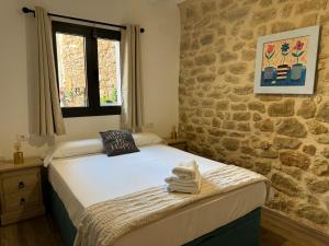 Postel nebo postele na pokoji v ubytování Casa Don Pelayo Boutique Apartments & Café