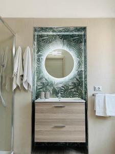 a bathroom with a sink and a mirror at Sweet Home in Vico Equense +10 photos