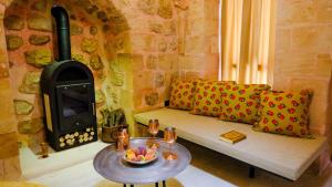 a living room with a couch and a wood stove at Rec326 in Mardin