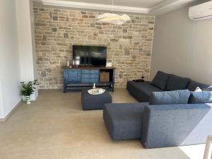 TV a/nebo společenská místnost v ubytování Villa Luna