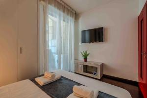 Televiisor ja/või meelelahutuskeskus majutusasutuses Loft Elegante in Centro Milano In zona Signorile - Davanti alla Metro