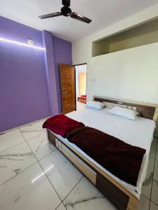 Katil atau katil-katil dalam bilik di Rudraksh Homestay