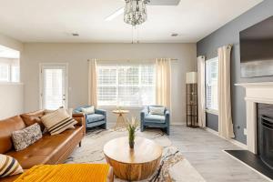 a living room with a couch and a fireplace at P&Ds Harmony House 20 Mins to Airport & Downtown in Decatur