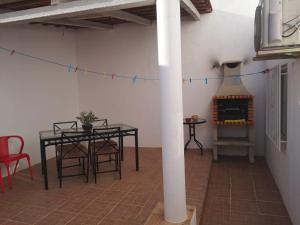 a living room with a table and a fireplace at Casa 33 in Lagos +8 photos