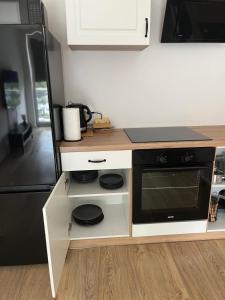 Kuchyňa alebo kuchynka v ubytovaní BTS Apartaments - Apartamenty Blisko Morza