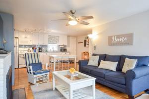 a living room with a couch and a table at 1 2 Mile to Nantucket Sound Beaches in Dennis