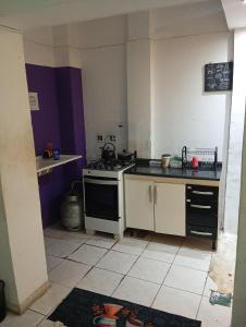 a kitchen with a stove and a counter top at Hostel em Copa in Rio de Janeiro