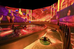 a water park with people in a hot tub at FUTUROGITE in Saint-Georges-lès-Baillargeaux