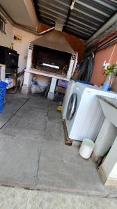 a washer and dryer sitting in a garage at Apart termas in Termas de Río Hondo +20 photos