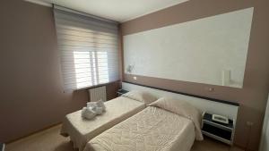 Postel nebo postele na pokoji v ubytování Hotel Belvedere