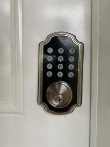 a door lock with a remote control in it at Ocean Dream Beachfront Studio with Balcony in Cabarete