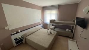 Postel nebo postele na pokoji v ubytování Hotel Belvedere