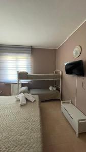 Postel nebo postele na pokoji v ubytování Hotel Belvedere