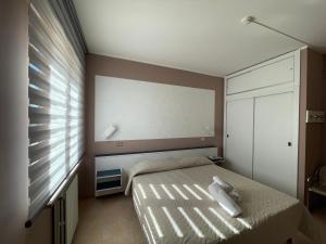 Postel nebo postele na pokoji v ubytování Hotel Belvedere