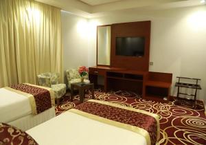 Postel nebo postele na pokoji v ubytování Wow Hotel Jeddah