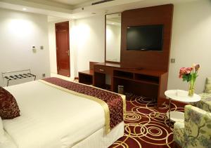 Postel nebo postele na pokoji v ubytování Wow Hotel Jeddah