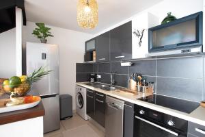 Kuchyň nebo kuchyňský kout v ubytování Exceptionnel ! Appartement 2 chambres vue sur le lagon