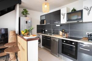 Kuchyň nebo kuchyňský kout v ubytování Exceptionnel ! Appartement 2 chambres vue sur le lagon