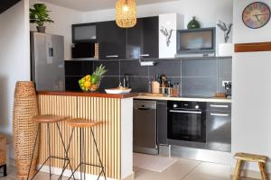 Kuchyň nebo kuchyňský kout v ubytování Exceptionnel ! Appartement 2 chambres vue sur le lagon