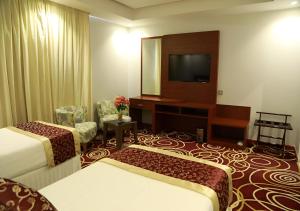Postel nebo postele na pokoji v ubytování Wow Hotel Jeddah