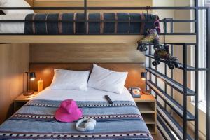 A bed or beds in a room at Moxy Boulder