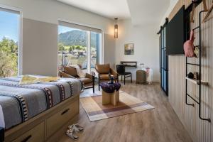 A bed or beds in a room at Moxy Boulder