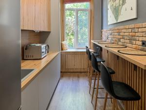 Kuchyň nebo kuchyňský kout v ubytování Apartments White Pearl Sadova